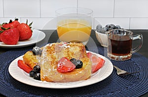 French toast with fresh fruit and syrup