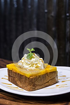 French toast with mango and whipped cream