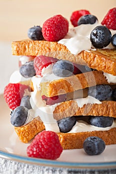 French toasts with creme fraiche and berries for breakfast