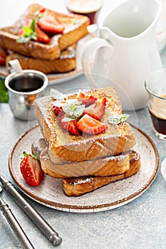 French toasts with strawberry and powdered sugar
