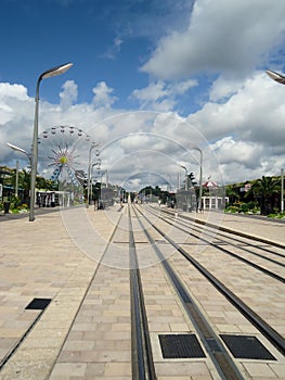 French Tram Track under the blue clouded sky. Web background.