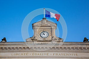 French tricolor flag with mairie liberte egalite fraternite france text building mean town hall and freedom equality fraternity in