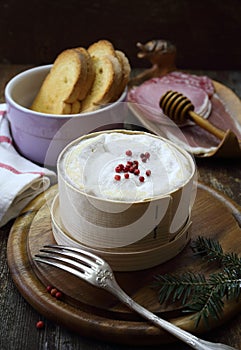 French Vacherin Mont d`Or cheese, cold cuts for fondue