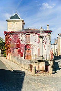 French village - typical house and road chapel in Medoc, France