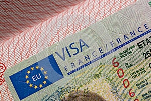 French visa stamp in a travel passport, France Schengen visa, immigrant, work and travel documents photo