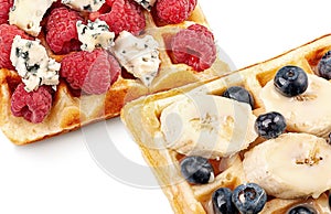 French waffles with berries, bananas and dorblu cheese isolated on white
