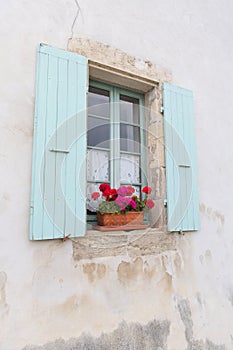 French window with blue blinds