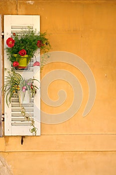 French window with hanging flowers with copy space