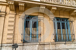 French windows, with steel lattice on the facade