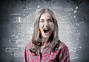 Frenzied young woman screaming with anger.