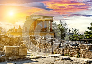 Fresco with bull and three columns in Palace Knossos under sunset, Crete island, Greece