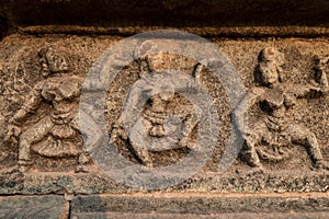 A fresco with dancing people on the wall of a ruined royal castle in Hampi, Karnataka, India.