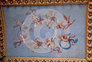 Fresco with eight winged puppets that seem to dance in the Vatican museums in Rome (Italy)