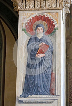 Fresco of Saint Monica in San Gimignano, Italy photo