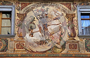 Fresco with St. George on medieval building photo