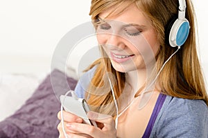 Fresh adolescent girl listening to music photo