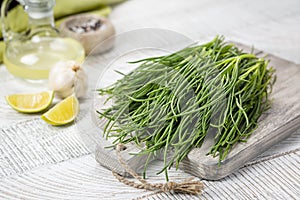 Fresh Agretti or barba dei frati, edible green plant. Saltwort