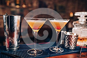 fresh alcoholic cocktails on bar counter. Close up of bar details with beverages and drinks photo