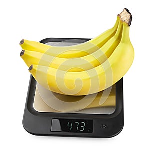 Fresh appetizing bananas. fruit on kitchen scales on wh