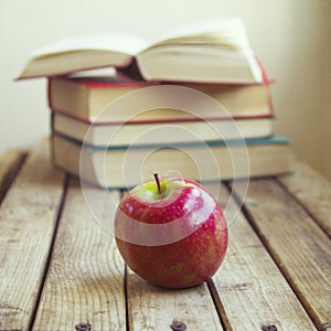 Fresh apple and books