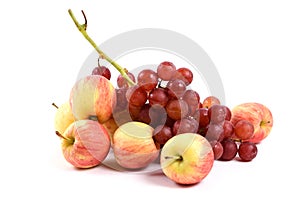 Fresh apple and grape on white