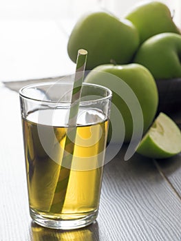 Fresh apple juice and green apples