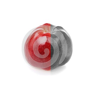 Fresh apple with red and decolourized half