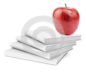 Fresh apple on stack of white books