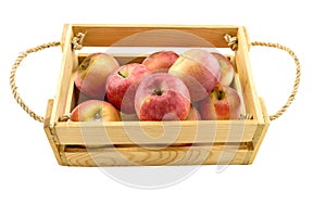 Fresh apple in a wooden box on a white background