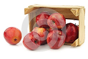 Fresh apples called `red love` in a wooden crate