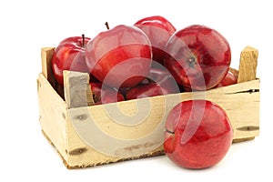 Fresh apples called `red love` in a wooden crate