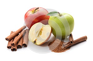 Fresh apples and cinnamon sticks on white background