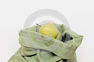 Fresh apples in eco cotton bag on white background. Zero waste shopping. Sustainable lifestyle