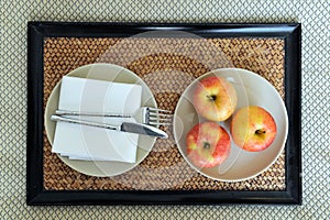 Fresh apples on laid table photo