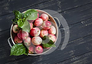 Fresh apples in a vintage colander