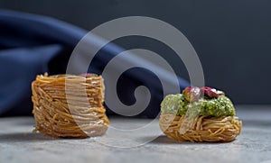 Fresh arabic sweets on light stone background