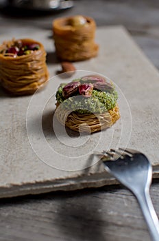 Fresh arabic sweets on light stone background
