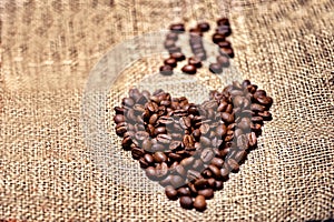 Fresh and aromatic coffee beans on vintage cloth