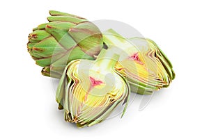 Fresh Artichokes and half isolated on white background closeup
