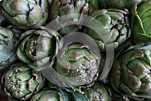 Fresh artichokes for sale at farmer`s market.