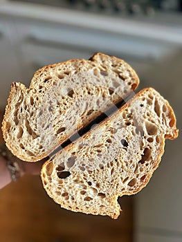 fresh artisan bread, sourdough bread, crusty bread, slices of bread, buttered slices of bread, coarse salt