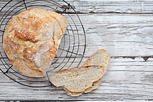 Fresh Artisanal Bread Cooling on Bakers Rack