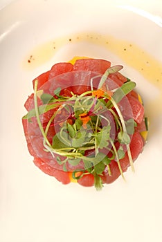 Fresh Asian seafood tartare with micro green salad