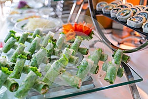 Fresh Asian spring rolls with shrimps, vegetables, fruit...on buffet table