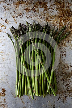 Fresh asparagus on rustic tray