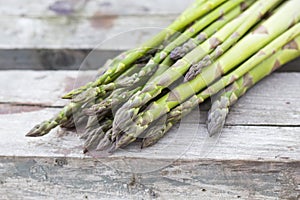 Fresh asparagus on wood surface