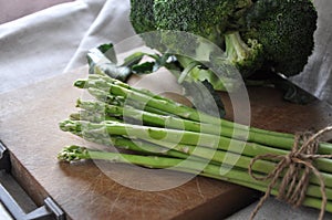 Fresh Asparagus on Wooden Board