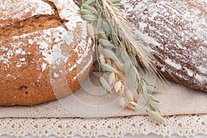 Fresh assorted breads with ears on the table