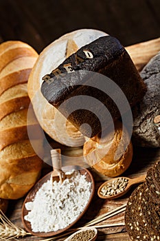 Fresh assorted loaves of gluten-free bread on wooden table