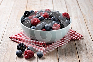 Fresh assortment berries on wooden table